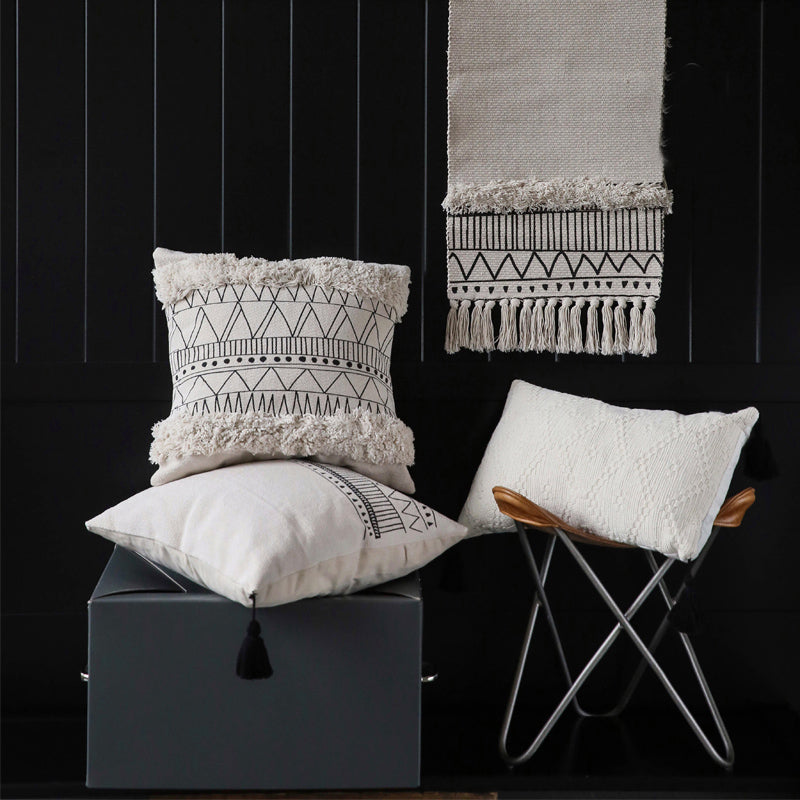 Geometric black and white tufted tassel pillow
