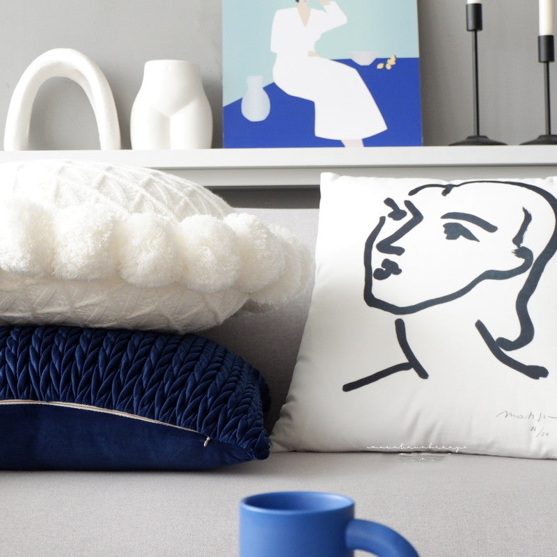 Round pillow head cushion b&B is wrapped in navy blue