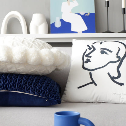 Round pillow head cushion b&B is wrapped in navy blue